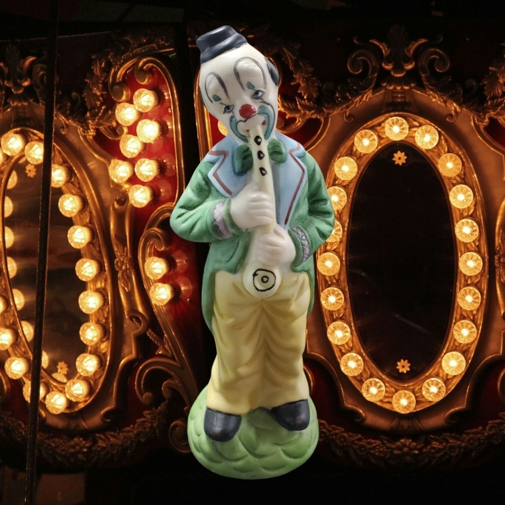 Clown playing instrument